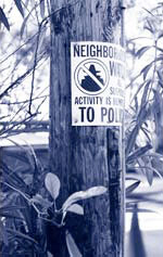 Neighborhood watch sign on a pole. Neighborhood watch sign on a wooden pole.