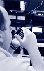 NIJ-263-www-9.jpg Officer talking in audio receiver