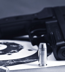 article03.jpg Bullet with gun in background