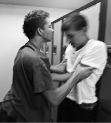 Woman gripping boy Woman with her hands gripping a boy's arms.