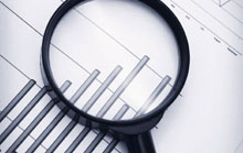 economists.jpg Magnifying glass over bar chart