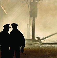477415847 Two officers overlooking a disaster scene