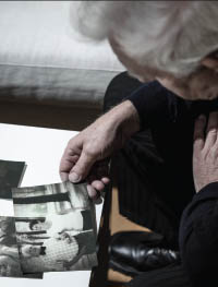 older-man-looking-at-photo.jpg Older gentelman looking at a photograph