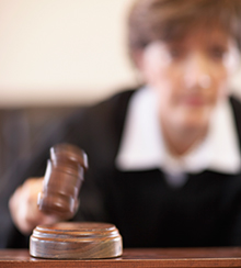 replicating-hope.jpg Judge striking with a gavel.