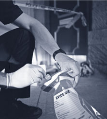 untested.jpg Crime scene tech putting evidence in a bag