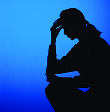 78480082 Silhouette of a person holding their head