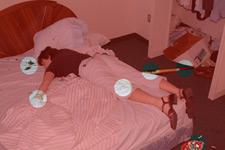 principles_of_dna_03_-_potential_evidence.jpeg Photo of a dead woman on a bed. The image highlights some of the pieces of evidence lying around her.
