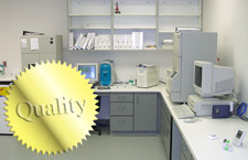 principles_of_dna_05_-_quality.jpeg Photo of a laboratory with a gold foil sticker on top that says Quality