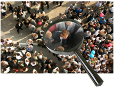 principles_of_dna_07_-_population_groups.jpeg Aerial photo of large group of people, with a magnifying glass over one man in the crowd