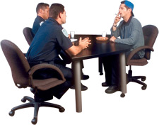 principles_of_dna_10_-_consent_2.jpeg Photo of a police interrogation where the suspect is smoking a cigarette