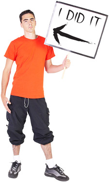 principles_of_dna_10_-_self-incrimination.jpeg photo of a young man in 90's attire holding a sign that says "I Did It" with an arrow point at himself