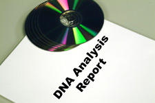 principles_of_dna_11_-_dna_analysis_report.jpeg Photo of a DNA Analysis Report with 5 CD's on top of it