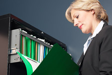 principles_of_dna_11_-_file_folder.jpeg Photo of a lawyer examining a case file