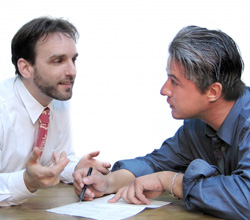 Verbal Communication Photo of two men having a verbal conversation