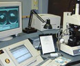 firearms_examiner_02_-_ibis.jpg Photo of a IBIS laboratory with multiple computer screens