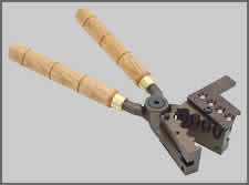 firearms_examiner_05_-_casting.jpg Handheld Bullet mold
