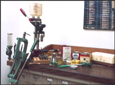 firearms_examiner_05_-_handloading.jpg Handloading Equipment - l-r powder measure, pre cartridges, red shotshell loader, case trimmer, kinetic bullet powder