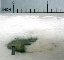 firearms_examiner_12_-_chemistry_2.jpg An ammonium hydroxidelift of a ricochet mark sprayed with DTO reagent