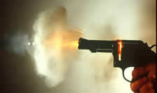 firearms_examiner_12_-_examination.jpg Revolver firing showing residues and bullet exiting
