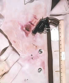 firearms_examiner_12_-_sodium_rhodizonate.jpg Blue-violet positive result for the Sodium Rhodizonate Test for lead with the evidence revolver, showing cylinder blast and muzzle blast