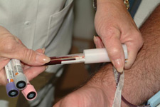 principles_of_dna_12_-_blood_sample.jpeg Photo of blood being drawn from someone's arm