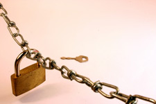 principles_of_dna_14_-_access.jpeg Photo of a padlock on a chain with a key in the background