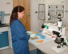 principles_of_dna_14_-_laboratory_testing.jpeg Photo of a laboratory technician running a test