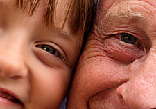 principles_of_dna_15_-_age_determination.jpeg Close up photo of a young child and an old man with their faces together