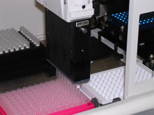 principles_of_dna_15_-_automation.jpeg Photo of lab equipment with lots of test tubes