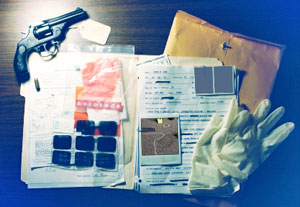 bph_cold_hits2.jpeg Collage of a gun, rubber gloves, case file, photographs