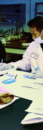 Interacting with Crime Labs - 3.jpeg image of a lab technician writing something down