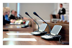 communicatelegislature_including.jpeg Photo of microphones in a courtroom