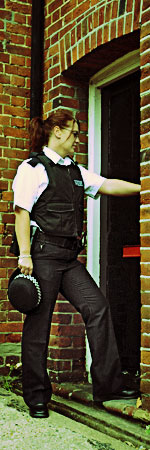 familial_searching_-_encouraging.jpeg British Police officer knocking on a door