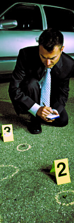 law_enforcement_responsibilities.jpeg image of a detective making notes at a crime scene