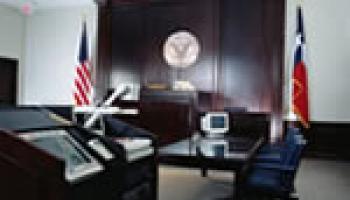 courtroom.jpg Photo of an empty courtroom with a testifying stand