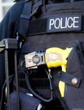 Police officer's vest with holstered Taser Police officer's vest with holstered Taser